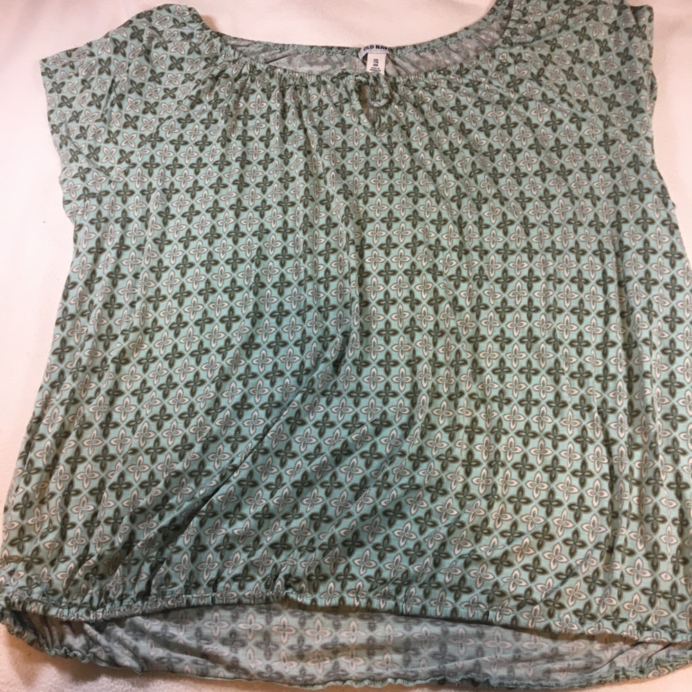 Cap sleeved top with geometric teal pattern